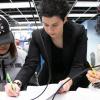 Dimitra Psychogiou works with two students in the ECEE circuits lab. 