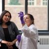 Chatterjee working in the lab with a student
