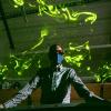 John Crimaldi watches as green laser light illuminates plumes in his lab's test flume. 