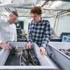 Greg Rieker and a colleague in the lab.