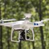 Drone flying in woods
