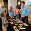 Children ask questions about EdBoard during the Demo Days "petting zoo."