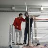 Misha and another researcher working on the turbine
