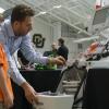 A student demonstrates his healthcare-related project to a young Expo visitor. 