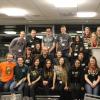 Volunteers standing in rows for a group picture 