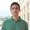 Filipe Henrique in a green striped shirt posing outside of JSCBB