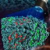 A microscope shining light on the system