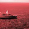 The USS Portland test-fires a laser weapon. The photo captured infrared light to make the beam visible. Staff Sgt. Donald Holbert/Marine Corps via AP