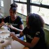 Two Girls Inc. Eureka! students in the midst of testing their water filters