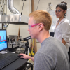 Graduate students working in lab