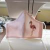 Greg Potts flamingo mask on sewing machine