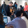 students collaborating around computers