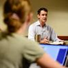 Physics major Francesco Vassalli and environmental science major Jenna Engleken listen as lecturer Kane Turner talks during a discussion of “The Republic” by Plato (photo by the Daily Camera)