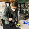 Rachel Sharpe works on a 3D printed mask component in the ITLL