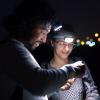 Kaushik and student in a field at night