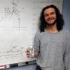 Keith Regner in front of whiteboard with strain gauage.