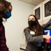 A student explains her engineering design project during an expo in the ITLL