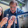 Alan W. Weimer in his lab with a student 