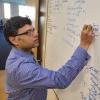Prashant working on a whiteboard 