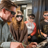 Researcher Scott Diddams in his laboratory with students