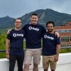 Fletcher Richman with Halp co-founders Tristan Rubadeau and Komran Rashidov on a balcony in Boulder with the Flatirons in the background.