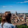 Woman looks over Rome city view