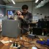 Joss Gitlin, Andrew Shepherd and Julian Torres troubleshoot their safecracking robot in the BTU Lab