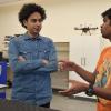Lahijanian speaking with a student in his lab.