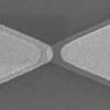 This scanning electron microscope image shows the distinct bow tie shape of an optical rectenna. (Credit: Moddel lab)