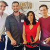 ShineOn team members standing with bike light.