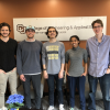 Stride Tech team stands together after winning the hardware track