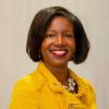 Terri D. Wright headshot wearing yellow blazer