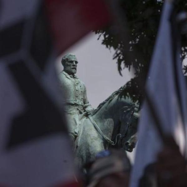 Group of protestors in front of Robert E. Lee statue.
