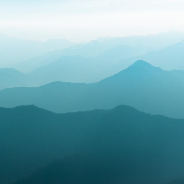 A series of mountains vanishing in the distance