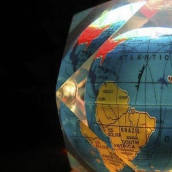 A globe in a glass cube