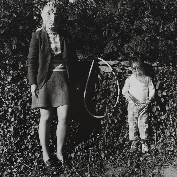 Photo of woman and child both wearing masks