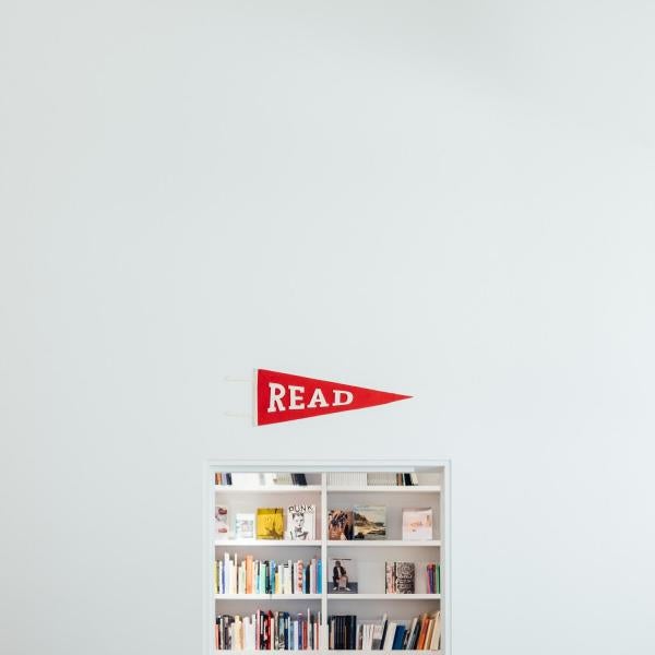 Red read banner above a bookshelf