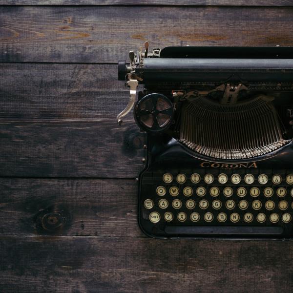 typewriter on wooden desk