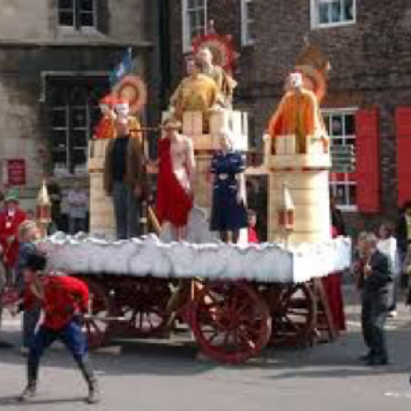 A parade of people in Medieval clothing