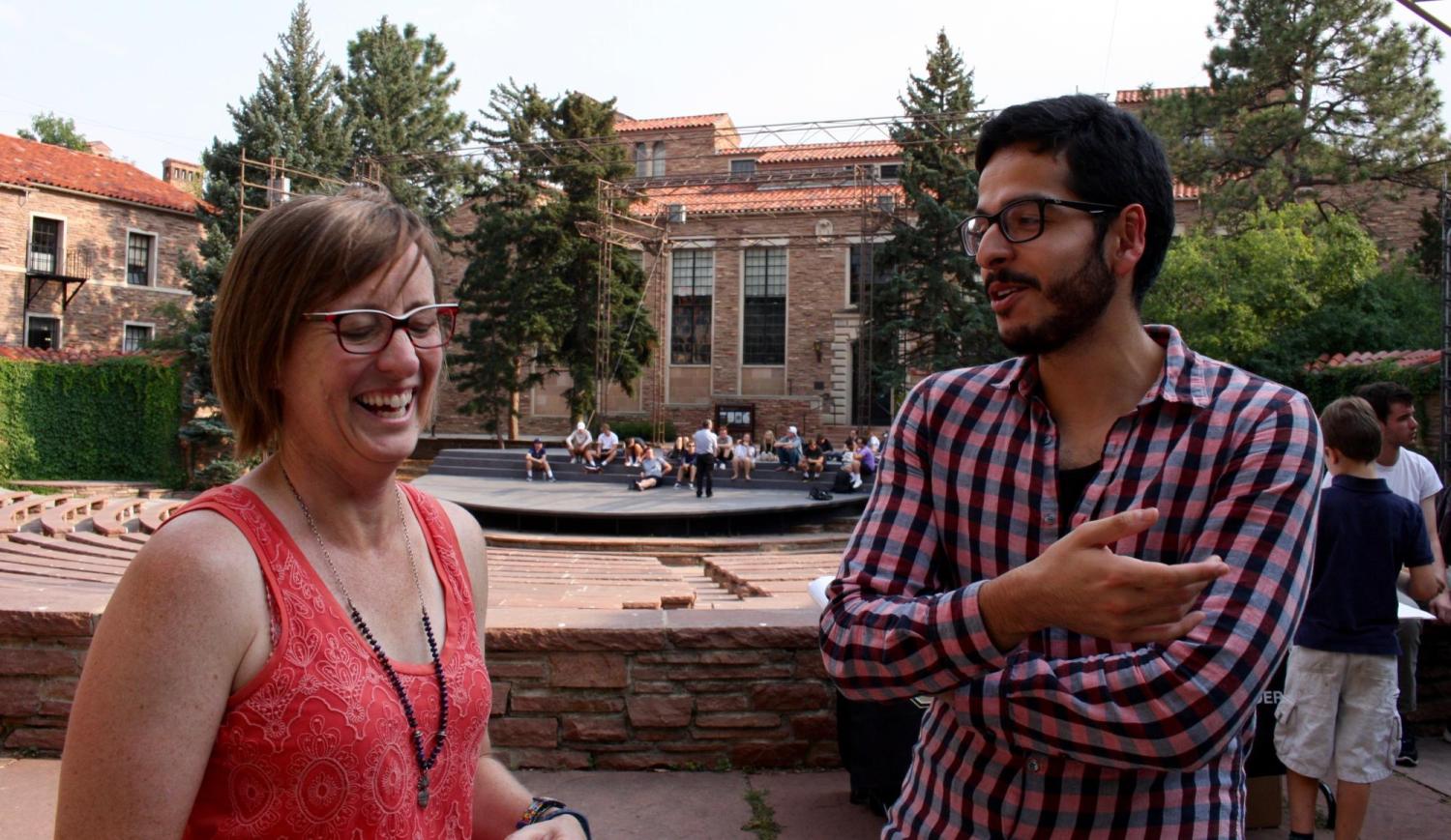 Instructor and student talking and laughing. 