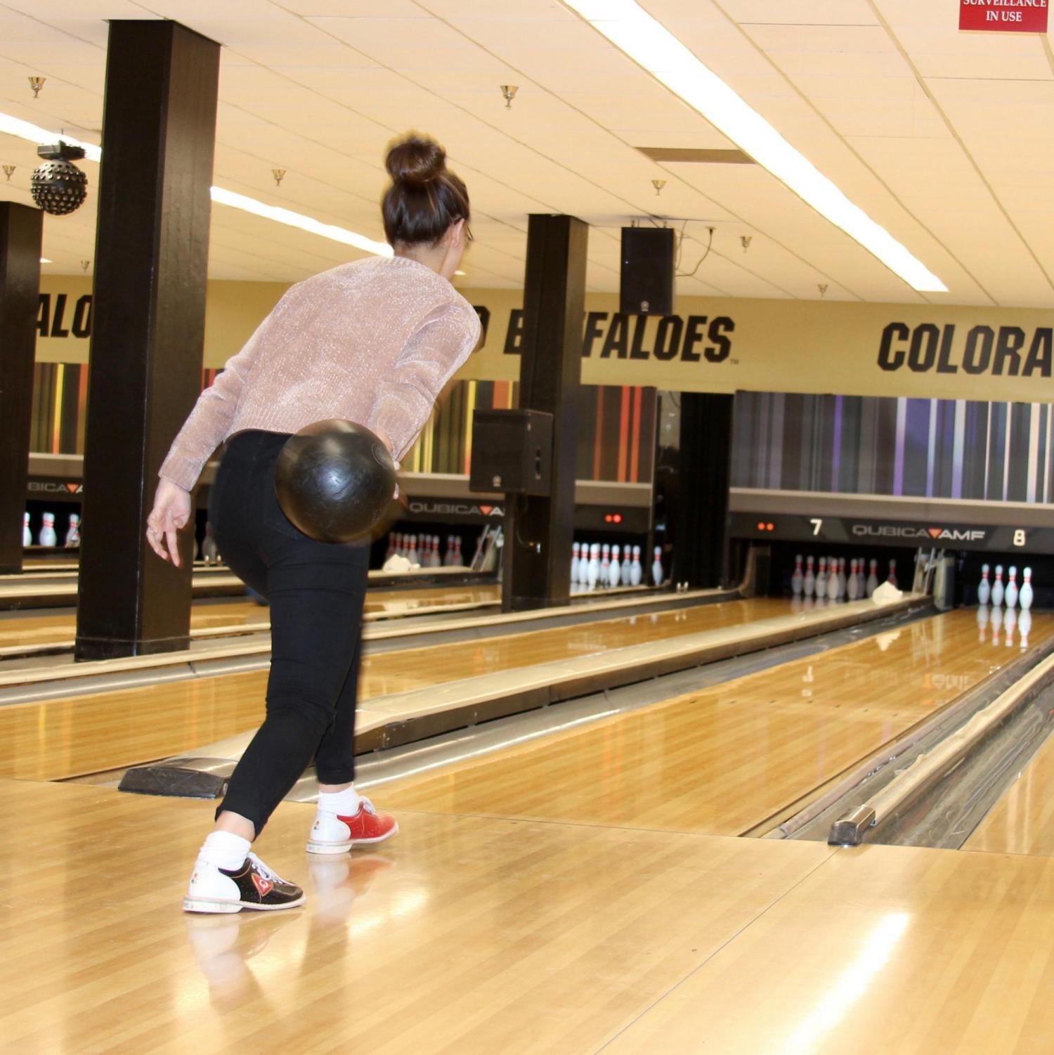 Student bowling at event