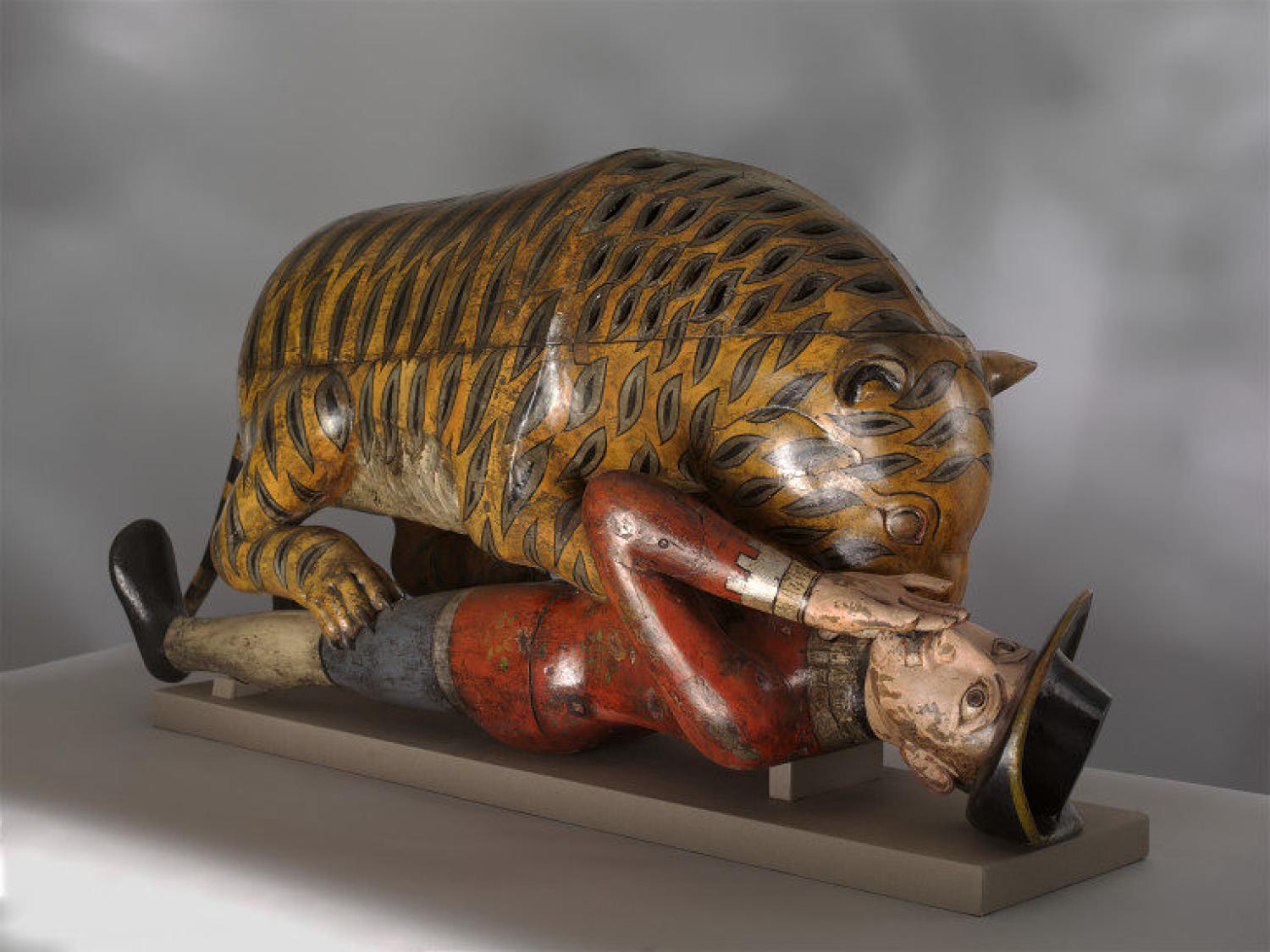 Tiger eating a man sculpture
