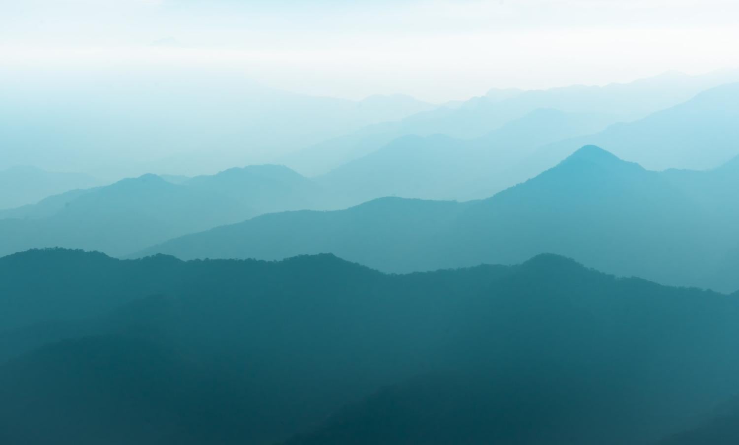 A series of mountains vanishing in the distance