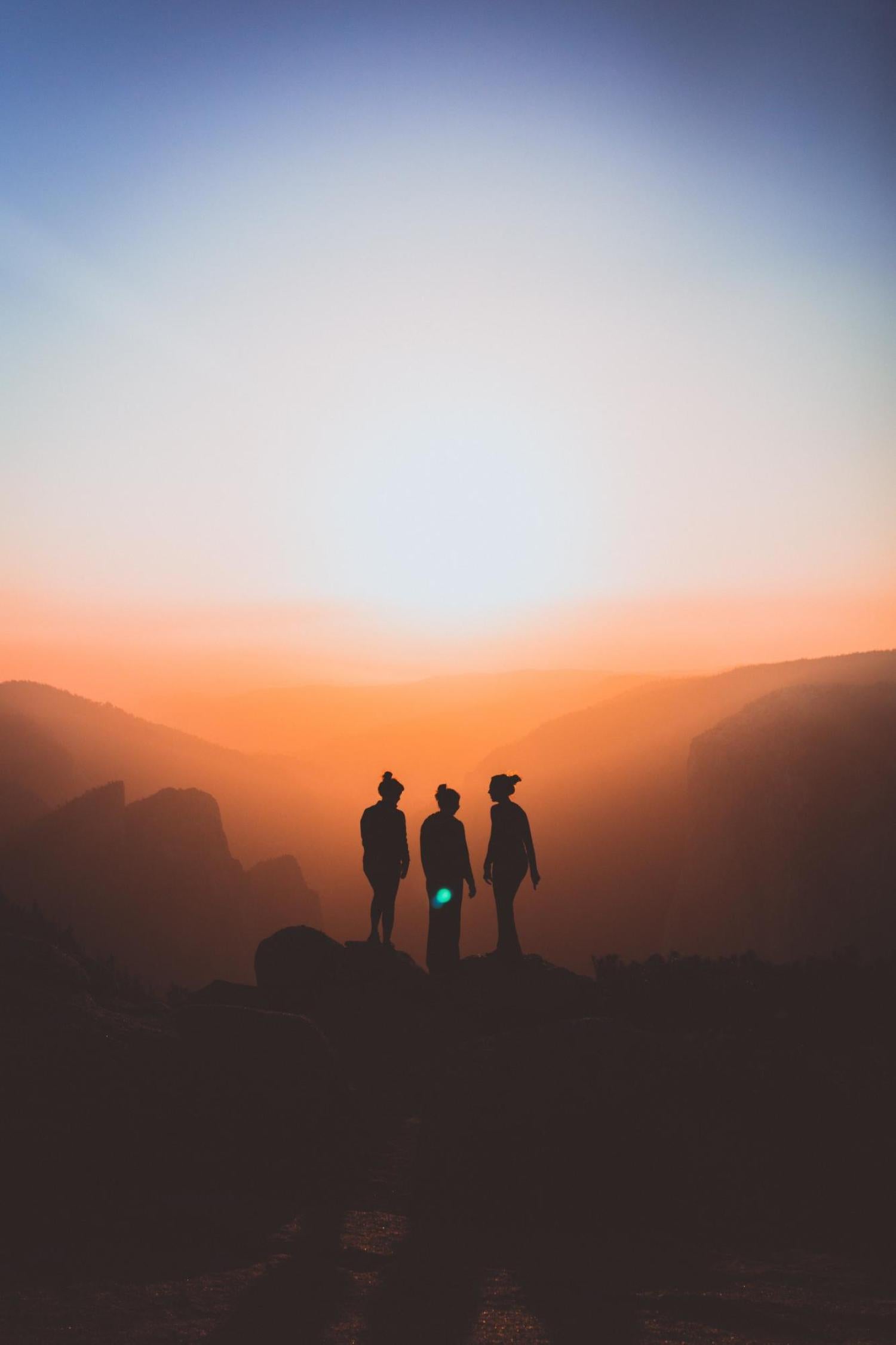 women silhouette in sunset
