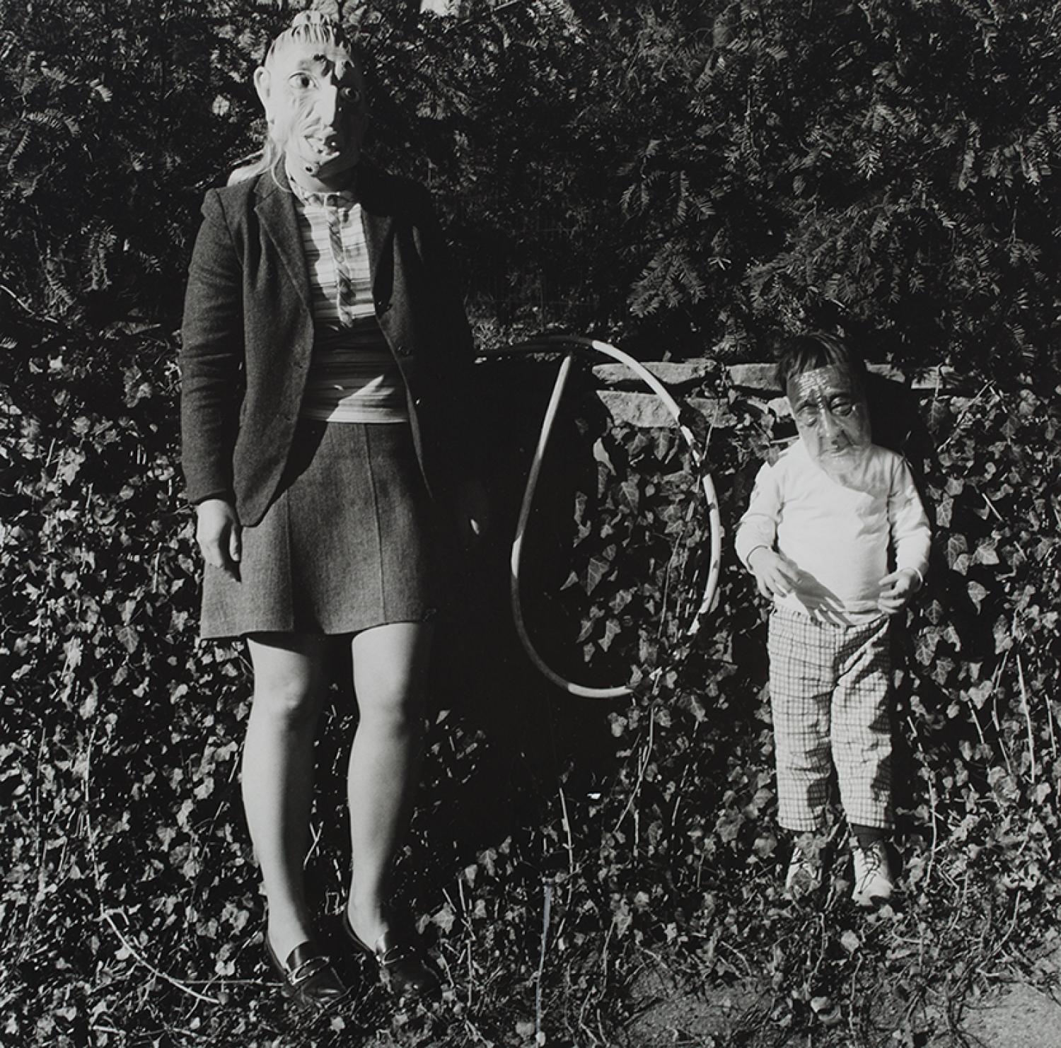 Photo of woman and child both wearing masks