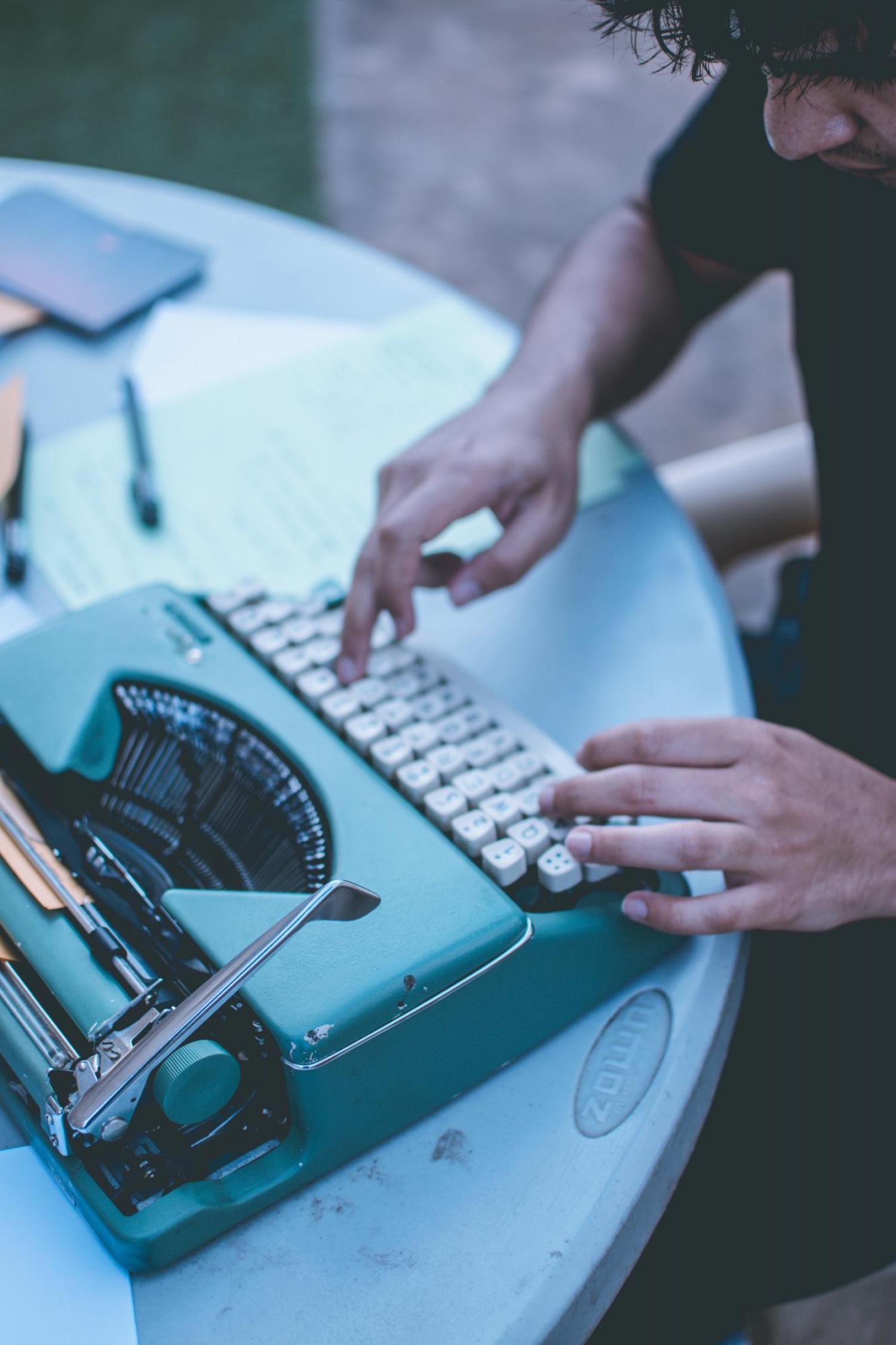 typewriter on wooden desk