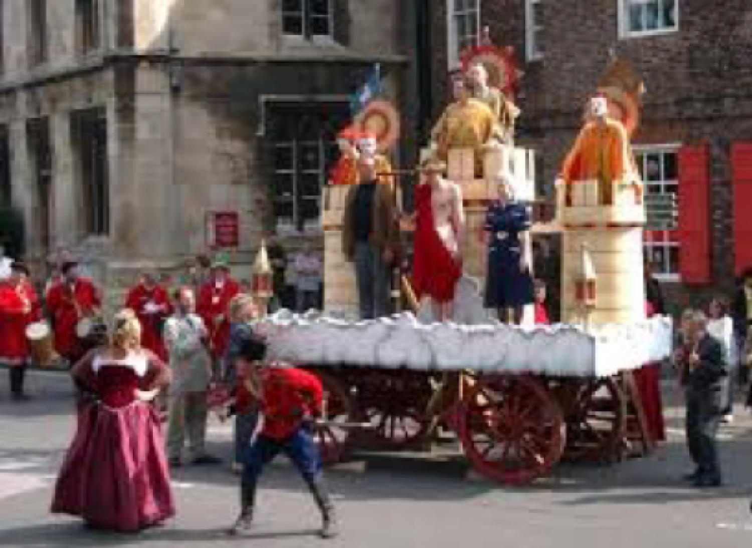 A parade of people in Medieval clothing