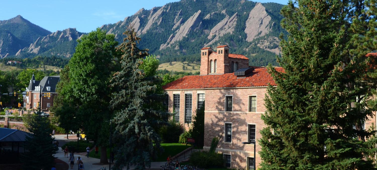 Hellems, home to the English Department, with the Flatirons in the background