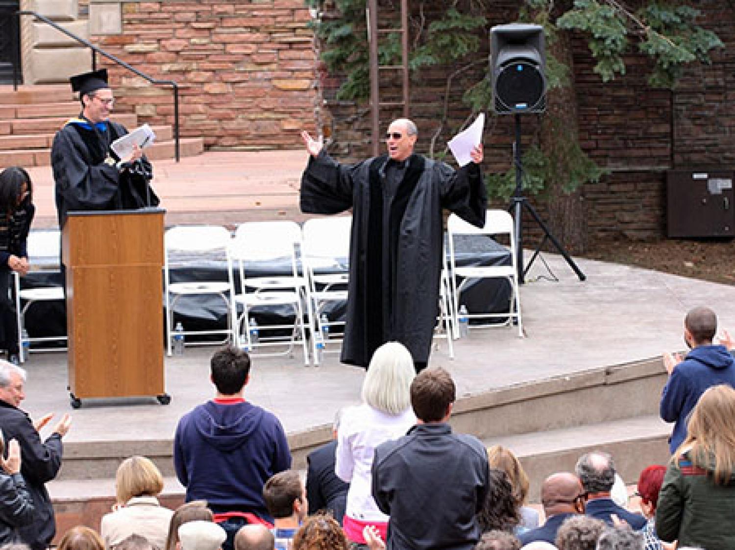 Art being applauded after his speech