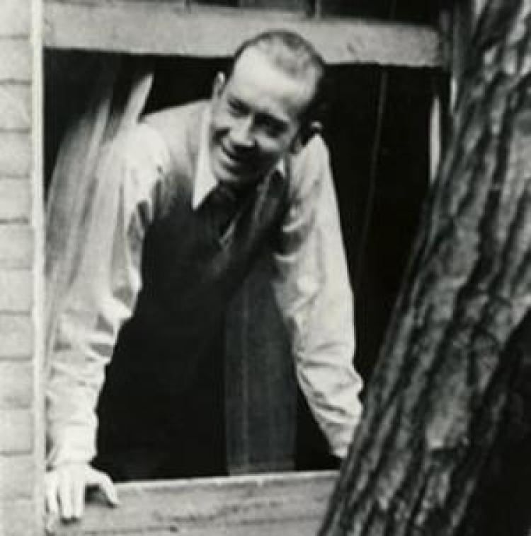 E.E. Cummings looking out of a window